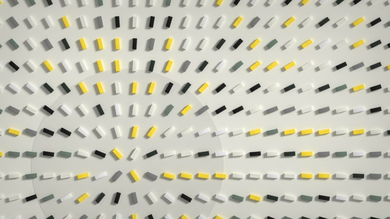 Designbild von Germanedge: weiße, gelbe und schwarze Klötze, die auf einen zentralen Punkt ausgerichtet sind
