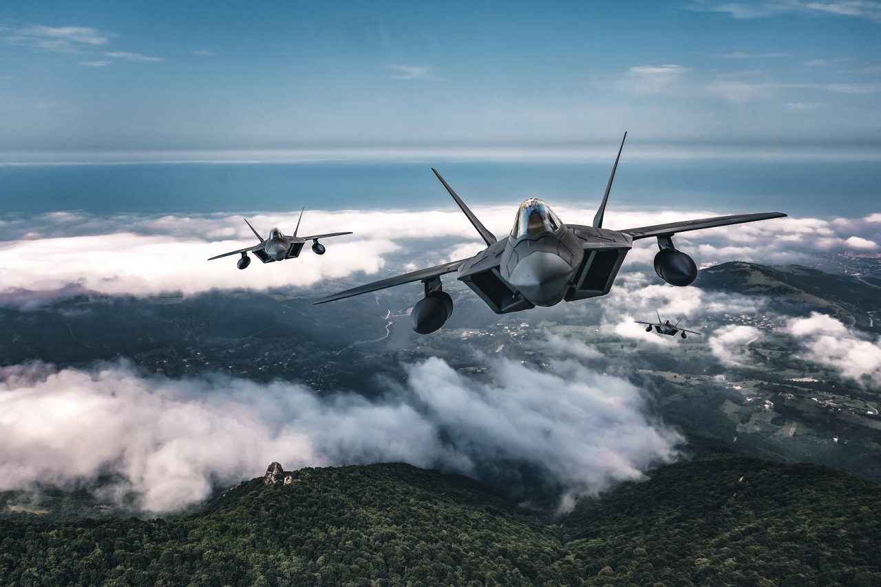 3 fighter planes above the clouds